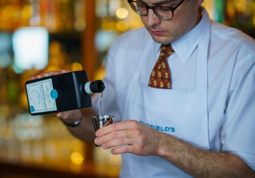 Daniel Schofield pouring Schofield's Dry Vermouth