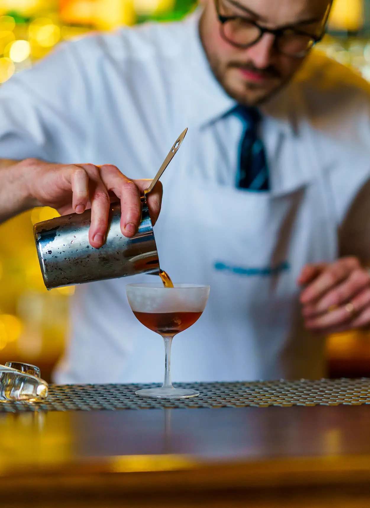 Joe Schofield pouring a Manhattan Cocktail