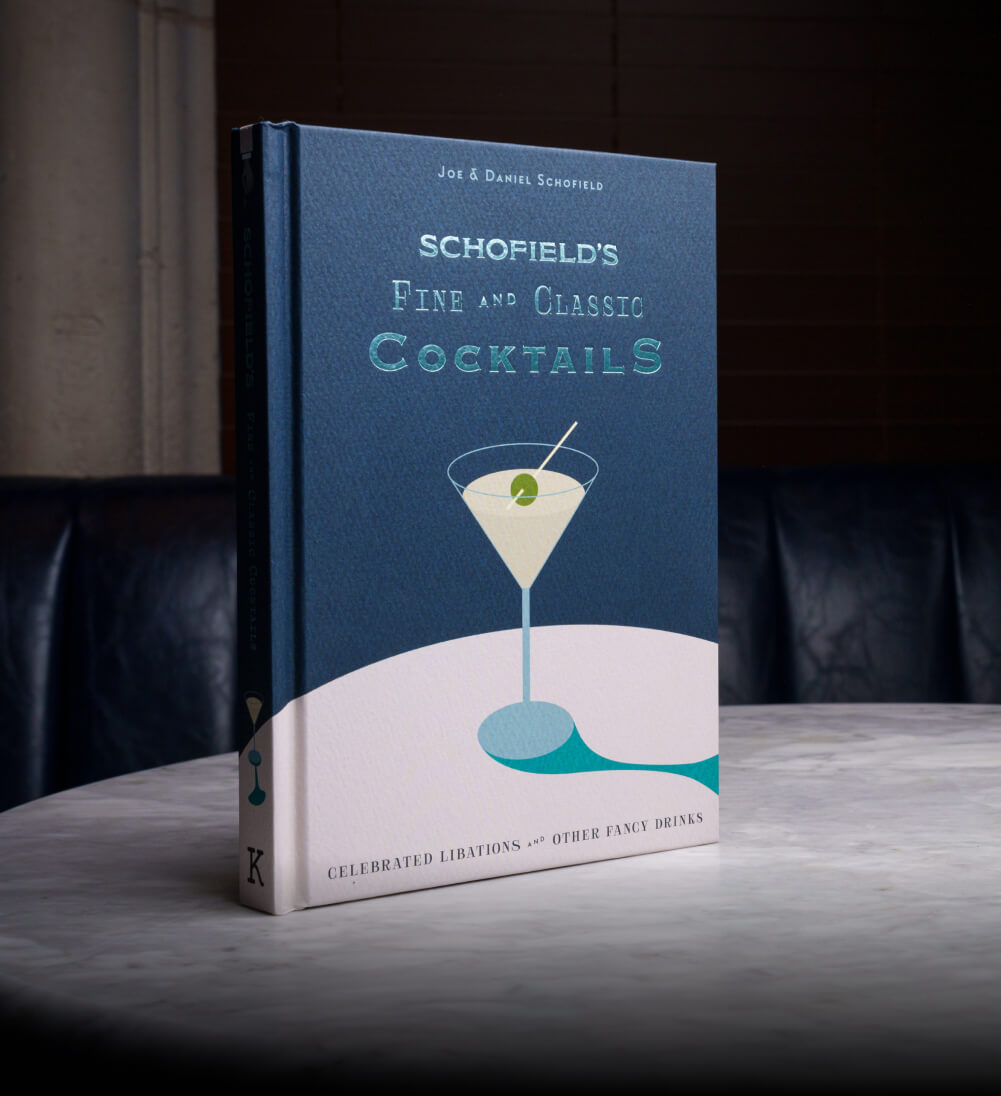 Schofield’s fine and classic cocktails book on a table